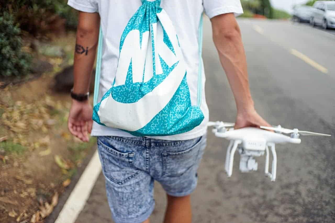 man walking with drone